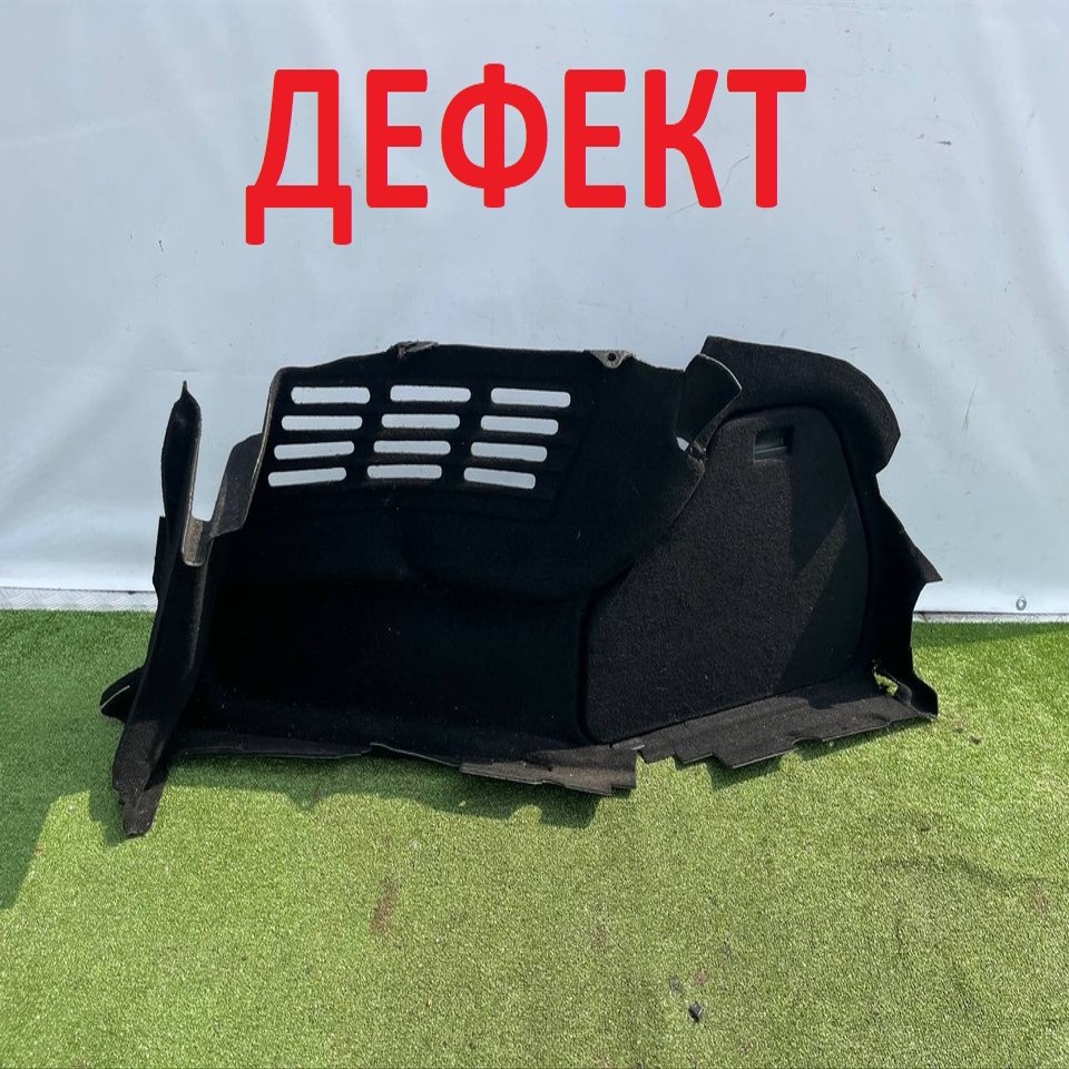  Обшивка багажника левая 