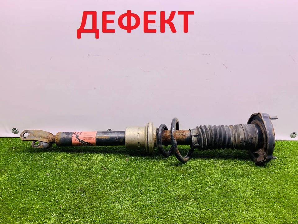  Стойка амортизатора передняя 