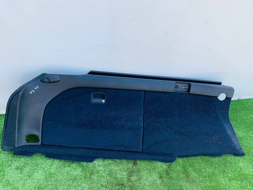  Обшивка багажника левая 