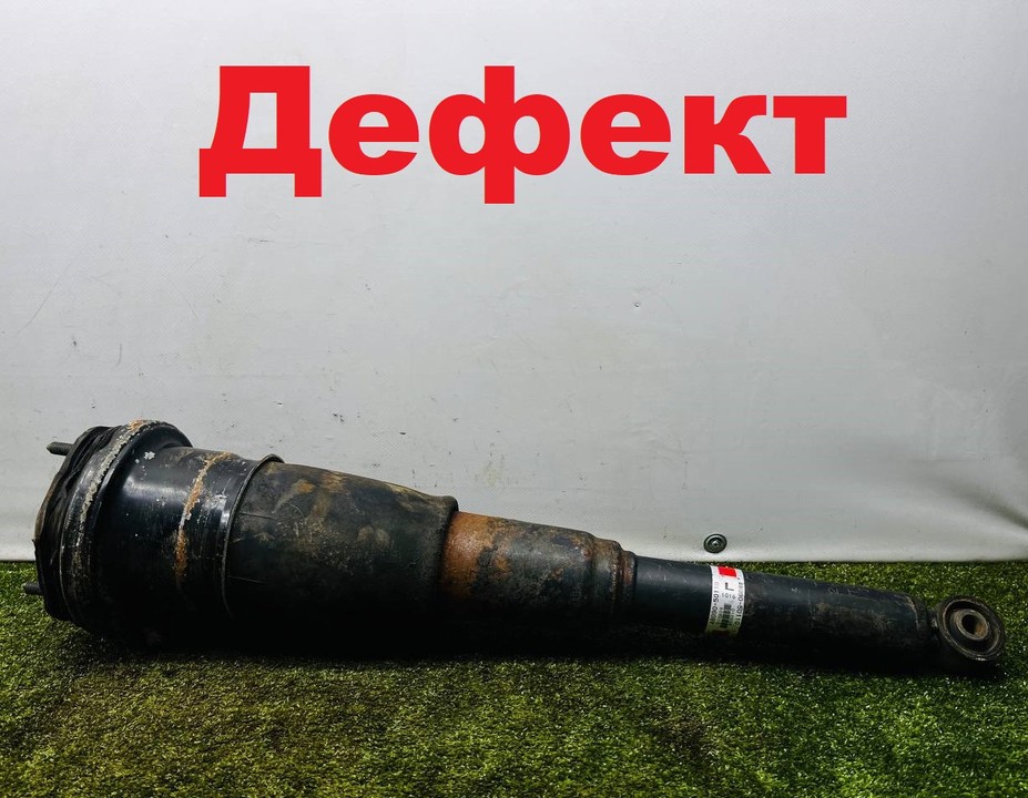  Стойка амортизатора задняя левая 